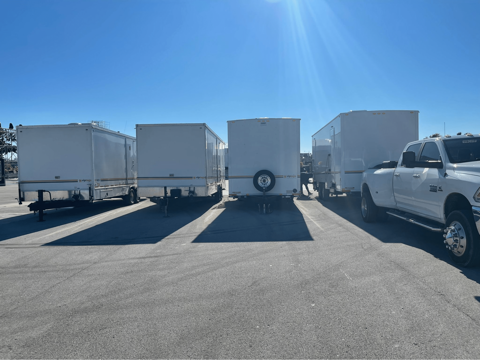 row of parked portable restrooms for parks 