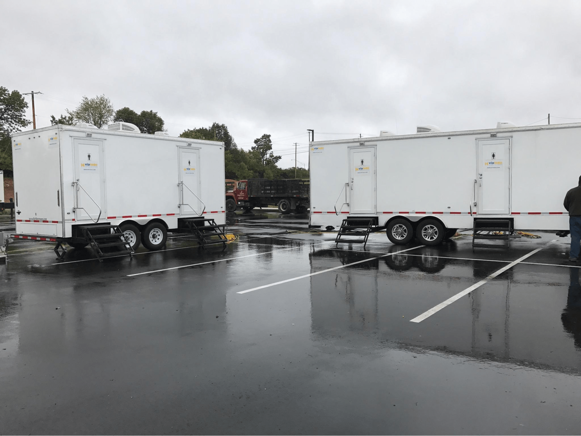 Several VIP To Go portable restroom trailers for festivals